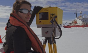 Female scientist surveying the ice